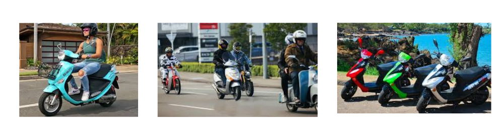 Woman wearing a helmet rides a turquoise scooter in a parking lot/driveway area with buildings in the background, smiling at the camera likely for casual riding context.